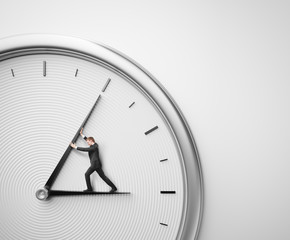 Businessman trying to stop time © SFIO CRACHO