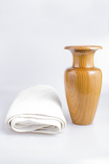 Wooden jug of water and white towel