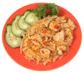 Stewed cabbage with chicken, fresh cucumber and parsley.