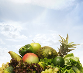 Pile of fresh and tasty fruits and vegetables isolated on white