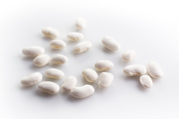 Fototapeta na wymiar White haricot beans on white background