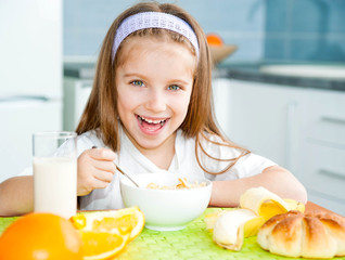 little girl eating her breakfast