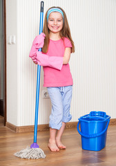 little girl washing the floor