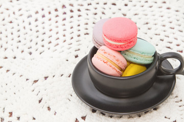 Pastel colorful macaroon,france  macaroon in coffee cup