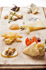 Fancy Cheeseboard with italian Cheeses ready for degustation. Go