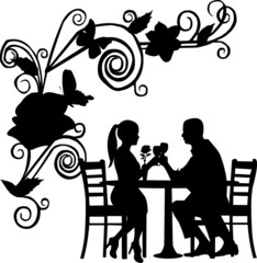 Background with flowers and romantic couple in restaurant