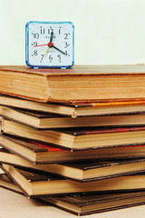 alarm clock and books.