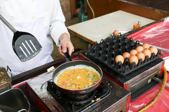 A Chef Is Cooking An Omelet For A Breakfast