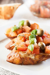 Bruschetta with mozzarella and tomato. Selective focus