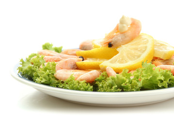 Boiled shrimps with lemon and lettuce leaves