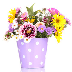 beautiful bouquet of bright flowers in metal pot isolated