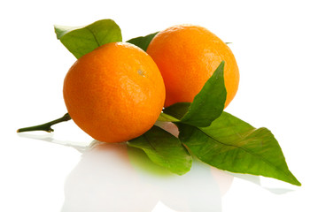 Ripe sweet tangerines with leaves, isolated on white