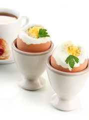 Light breakfast with boiled eggs and coffee, isolated on white