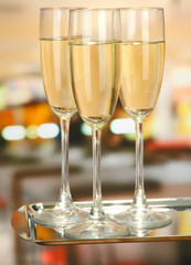 Corporate party: sparkling champagne glasses on tray