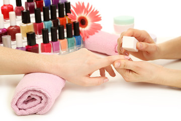 Manicure process in beauty salon, close up