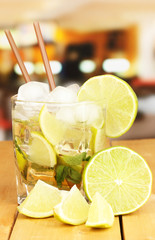 Glass of cocktail with lime and mint