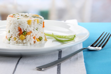 Delicious risotto with vegetables on table in cafe