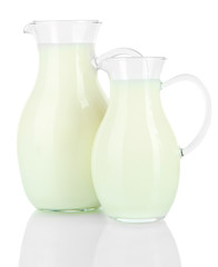 Pitchers of milk isolated on white