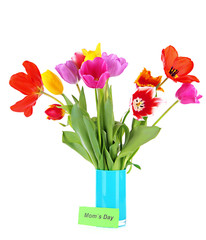 Beautiful tulips in bouquet with note isolated on white