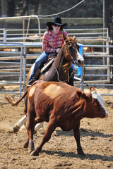Young woman is riding a horse