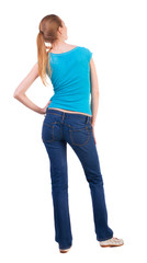 Obraz premium back view of standing young beautiful blonde woma