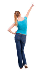 Fototapeta premium Back view of pointing woman