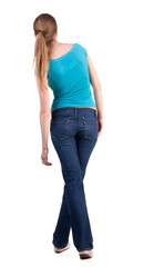 Fototapeta premium back view of standing young beautiful blonde woman