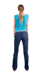 Fototapeta premium back view of standing young beautiful blonde woman
