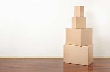 Cardboard boxes stack in apartment, moving day