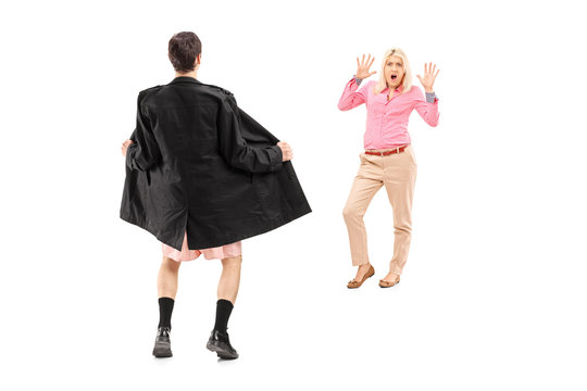 Full Length Portrait Of A Flasher Scaring A Young Woman