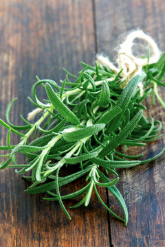 Fresh rosemary on a wooden board
