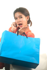 Busy young Asian business  woman with shopping bags .