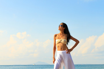 Fototapeta na wymiar Woman in sarong on the beach