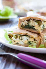 slices of cake with eggs and greens