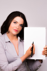 Young professional female presenting in a meeting