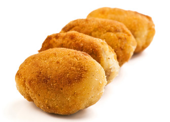 group filled with gold croquettes on white base