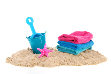 Towels and toys at the beach