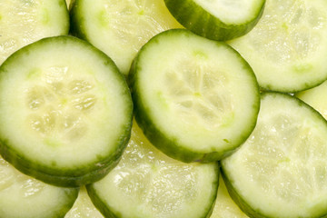 Freshly sliced cucumber  isolated on white background