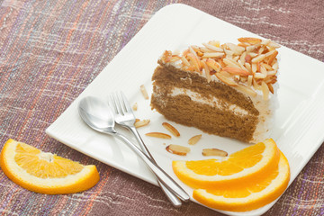 coffee almond cake , home made bakery with orange slice
