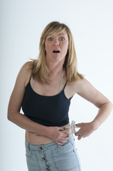 Woman shocked expression body fat caliper guage