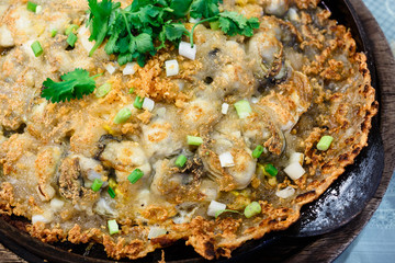 Crisp fried oyster pancake in hot plate
