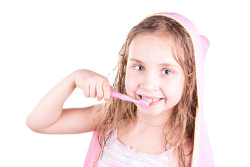 Beautiful happy smiling little girl brushing her teeth