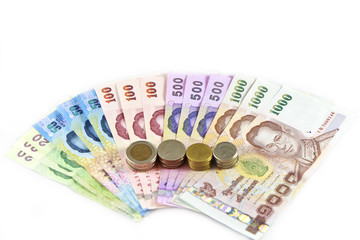 Thailand paper currency and coins isolated over white
