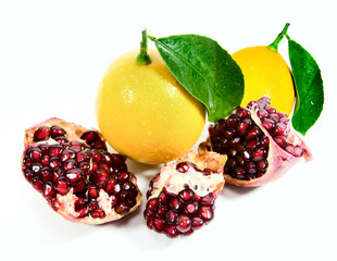 lemons and pomegranate on white