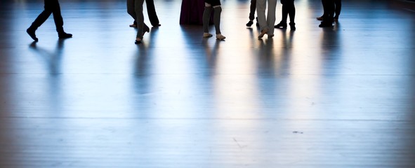 Women dancing feets reflected on floor