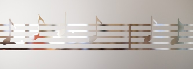 Musical notes on frosted glass, art background