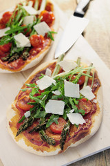 Food: Asparagus, rocket and cherry tomato pizza with Parmesan