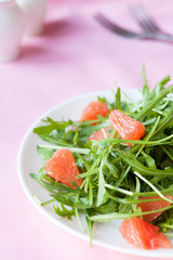 Salad of fresh arugula and grapefruit