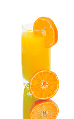 half an orange and a glass of orange juice on white background