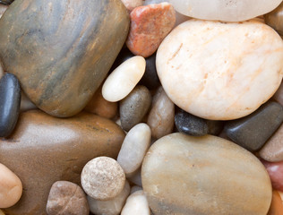 Fototapeta na wymiar background of colored sea stones